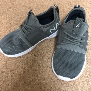 Boy’s grey shoes.